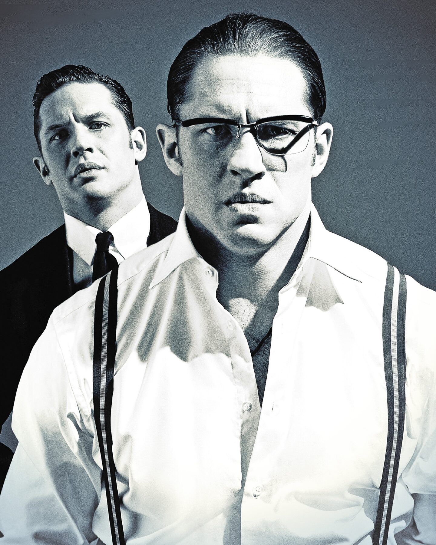 Tom Hardy as both Kray twins, in a white shirt and braces, black and white